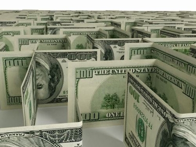 a bunch of one hundred dollar bills folded and standing up on a surface