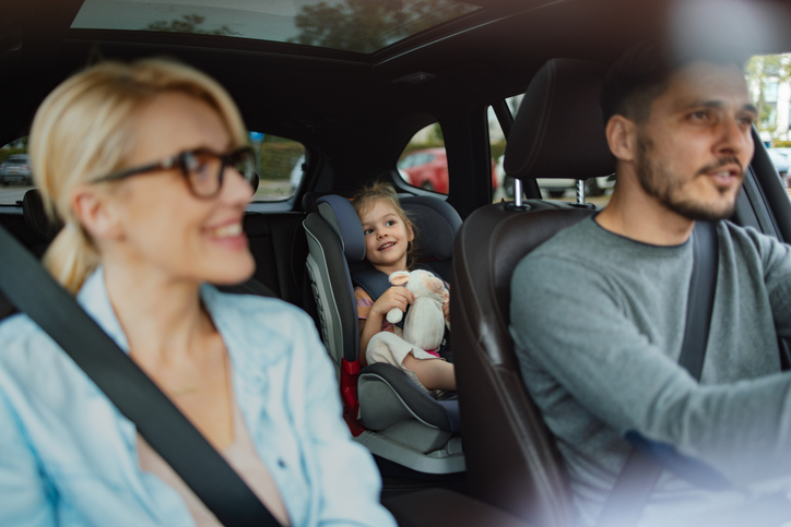 law on child sitting in front of car